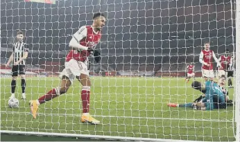  ??  ?? Pierre-Emerick Aubameyang celebrates scoring Arsenal's second.