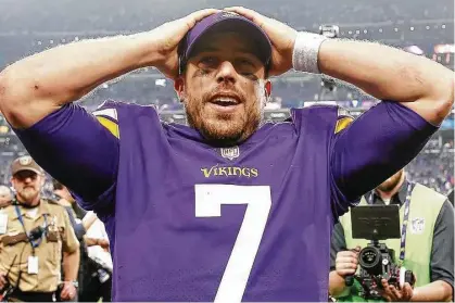  ?? Jamie Squire photos / Getty Images ?? Vikings quarterbac­k Case Keenum is in disbelief after tossing a game-winning 61-yard touchdown in Sunday’s playoff game.