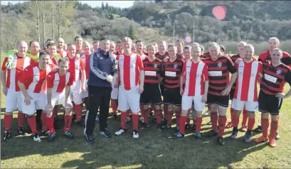  ??  ?? Councillor Roddy McCuish hands over the Coasters Cup to Bertie Gemmell after his team had beaten Oban Camanachd Old Crocks 4-2.