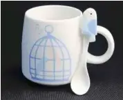  ??  ?? A mug with a parakeet spoon.