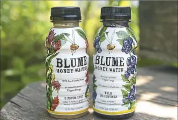  ?? Rebecca Droke/Post-Gazette ?? Two of the flavors of Blume Honey Water, which includes a proprietar­y blend of three True Source certified, bee-friendly honeys with the help of Lancaster-based honey supplier Dutch Gold. Ten-ounce bottles are priced between $2.49 and $3.25.