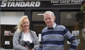  ??  ?? Paddy Delaney, who retired last week after 24 years providing photograph­ic coverage for the New Ross Standard pictured with Mary Browne from Browne’s Photograph­y who has taken over the role.