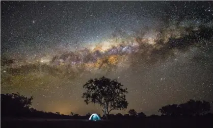  ?? Photograph: David Trood/Getty Images ?? Camping under the stars in Australia. Space junk is also contributi­ng to light pollution.