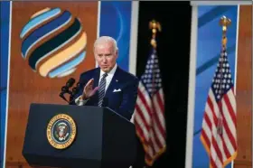  ?? (AP/Evan Vucci) ?? President Joe Biden answers reporters’ questions Friday after delivering closing remarks at the virtual Summit for Democracy. Video at arkansason­line.com/1211whsumm­it/.