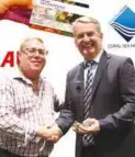  ??  ?? Partners … Air Niugini managing director Alan Milne presents a plaque to Coral Sea Hotels general manager Matthew Cooper. It was presented in appreciati­on of the company’s support for the airline’s Destinatio­ns Loyalty Program.