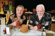  ?? AJC FILE PHOTO ?? “Waffle Palace Christmas” playwright­s Larry Larson (left) and Eddie Levi Lee are shown on the set of “The Waffle Palace” at Horizon Theatre in 2012.