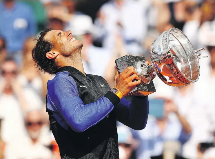  ?? — GETTY IMAGES ?? Rafael Nadal ended a nearly three-year drought without a Grand Slam title when he dispatched of Stan Wawrinka in straight sets to win his 10th French Open.