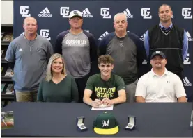  ?? Scott Herpst ?? Amber Helton and Chris Collins were among those present to watch Gordon Lee senior Griff Collins sign on to play baseball at Motlow State in Tennessee last week. Also there for the ceremony were Gordon Lee assistant coach Thomas Gray, Gordon Lee head coach Mike Dunfee, Gordon Lee assistant coach Derek McDaniel and Gordon Lee principal Michael Langston.