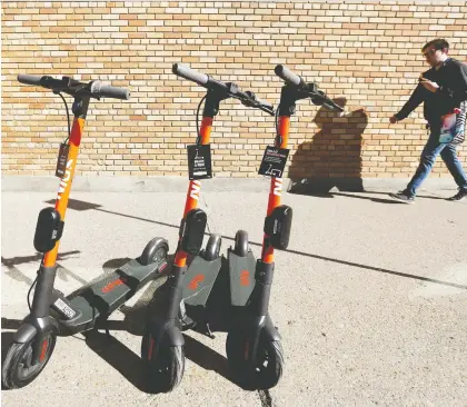  ?? DAVID BLOOM ?? San Francisco-based Spin has launched a fleet of 450 e-scooters in the city. They cost a dollar to unlock and 35 cents per minute to ride.