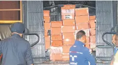  ?? AP ?? Boxes containing items confiscate­d from former premier Najib Razak are put inside a police truck in Kuala Lumpur, Malaysia yesterday.