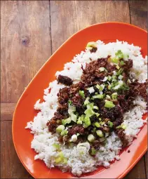  ?? KATIE WORKMAN VIA AP ?? This 2017 photo shows Mongolian beef over rice in New York. This dish is from a recipe by Katie Workman.