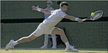  ?? TIM IRELAND / AP ?? After an early spat with the chair umpire, second-seeded Novak Djokovic (above) dispatched Latvia’s Ernests Gulbis in straight sets Saturday at Wimbledon. Djokovic earned his 10th appearance in the tourney’s second week.