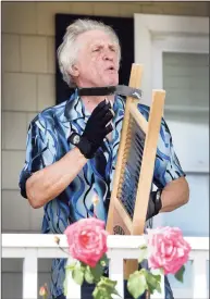  ?? ?? Peter Menta of Hamden, plays the washboard with the “Sweet Louise Band” during Milford Porch Fest Saturday.