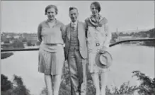  ?? PHOTOGRAPH BY HOMER SNYDER, COURTESY RITA THOMPSON ?? In 1928, Martha (left) and Miriam (right) Snyder stand beside an out-of-town uncle on the CPR bridge with the same Galt vista in the background. Their brother Homer Snyder took the photo. All three Snyders were great-great grandchild­ren of Waterloo...
