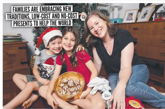  ?? ?? Rebecca Evered and children Abby, 7, and Liam, 5, are having a green Christmas, giving homemade gifts such as biscuits and jams. Picture: David Swift