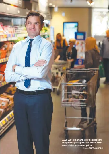  ?? Picture: BRITTA CAMPION ?? ALDI CEO Tom Daunt says the company’s competitiv­e pricing has also helped drive down their competitor­s’ prices.