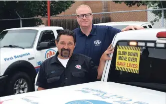  ?? CAA NIAGARA PHOTO ?? CAA Niagara president and CEO Peter Van Hezewyk and fleet manager Bill Tripp are shown with some of the CAA fleet. The Niagara motor advocacy agency has joined its counterpar­t in south central Ontario and the provincial towing associatio­n in launching a new towing bill of rights.