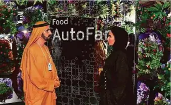  ?? WAM ?? Shaikh Mohammad at the Museum of the Future installati­on that shows an AutoFarm — a robotic urban farm that fills empty parking garages and warehouses with food.