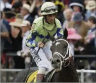  ?? MATT SLOCUM — THE ASSOCIATED PRESS ?? Always Dreaming ride by John Velazquez moves off the track after the running of the 142nd Preakness Stakes horse race at Pimlico race course, Saturday in Baltimore. Cloud Computing ridden by Javier Castellano won the race.