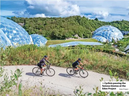  ?? Eden Project ?? > Cyclists passing the famous biomes at the Eden Project