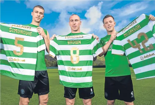  ??  ?? GETTING SHIRTY: Celtic’s Jozo Simunovic, Scott Brown and Callum McGregor after signing new contracts with the club