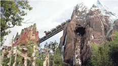  ?? JOHN RAOUX/AP ?? Visitors experience the Expedition Everest roller coaster at Walt Disney World’s Animal Kingdom.