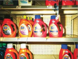  ?? EDMUND D FOUNTAIN/THE NEW YORK TIMES ?? Bottles of Tide laundry detergent, made by Procter & Gamble, under lock and key at a store in New Orleans, on Friday.