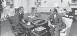  ?? CORBIS VIA GETTY IMAGES ?? THEN-PRESIDENT Richard Nixon and then-Vice President Gerald Ford discuss the transfer of power in 1974. Nixon’s failed attempt to stop probes of his activities is a lesson for President Donald Trump.