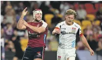  ?? ?? Fraser McReight celebrates a try as Damian McKenzie feels the pain during the Reds’ win over the Chiefs.