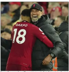  ?? (AP Photo/Jon Super) ?? Liverpool’s manager Jurgen Klopp celebrates with Cody Gakpo during Sunday’s English Premier League match against Manchester United. Gakpo had two goals as Liverpool won 7-0, equaling the biggest defeat in Man U’s history.