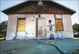  ?? Irfan Khan Los Angeles Times ?? JENNER KIM at his storage facility, which was damaged in the July Ridgecrest quakes. Researcher­s said the 7.1 July 5 quake was made up of four smaller events.