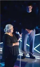  ??  ?? Rev. Robert Wright Lee IV, right, listens while Susan Bro speaks during the MTV Video Music Awards.