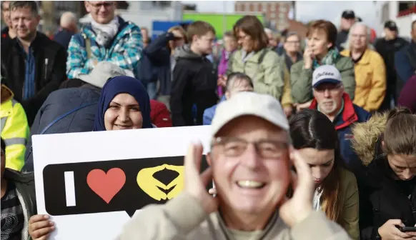  ?? AFP ?? Voters come out in support of Angela Merkel at a CDU election rally in the north German town of Kappeln