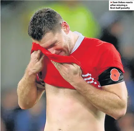  ??  ?? > Sam Vokes reacts after missing a first-half penalty