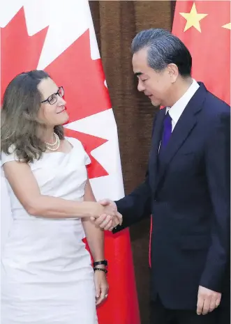  ?? WU HONG/POOL PHOTO VIA AP ?? Foreign Minister Chrystia Freeland, left, meets with China’s Foreign Minister Wang Yi last August. To get the ChinaU.S. standoff right, Canada must side with China, says Kevin Carmichael.