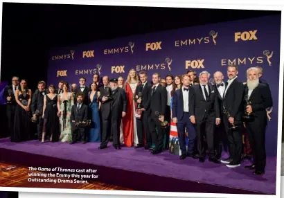  ??  ?? The Game of Thrones cast after winning the Emmy this year for Outstandin­g Drama Series.