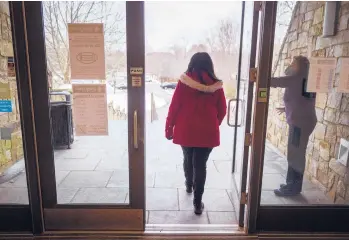  ?? MARK MIRKO/HARTFORD COURANT ?? After speaking with a group of teachers, Sheena Graham leaves the Mark Twain House on Tuesday. Graham, Connecticu­t’s 2019 Teacher of the Year, retired at the end of January, years before she expected.