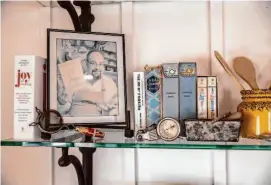  ?? Stephen Lam/The Chronicle ?? Mementos, including various early editions of the “Joy of Cooking” cookbook, are displayed on a shelf at Rombauer Vineyards in Napa Valley.