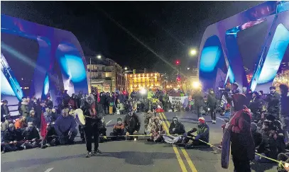  ?? TIMES COLONIST ?? Monday’s march saw protesters conduct a sit-in on the Johnson Street Bridge for more than an hour.