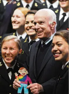  ?? WILLIAM THOMAS CAIN / GETTY IMAGES 2017 ?? U.S. Sen. John McCain, R-Arizona, poses with Naval cadets after receiving the 2017 Liberty Medal at the National Constituti­on Center on Oct. 16, 2017, in Philadelph­ia. He has been home in Arizona battling brain cancer in recent months.