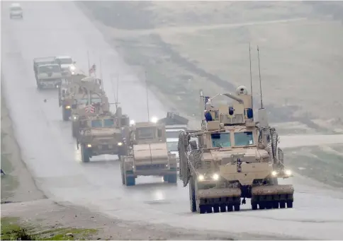  ??  ?? File photo shows a convoy of US military vehicles in Syria’s northern city of Manbij. — AFP photo
