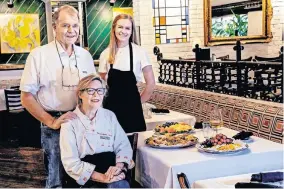  ??  ?? Owner Joe Sparks, wife Rebecca and daughter Eva pose for a photo recently in the dining room at Legend's Restaurant in Norman. Legend's is preparing to reopen its dining room for the first time since April for its annual Thanksgivi­ng feast. [CHRIS LANDSBERGE­R/THE OKLAHOMAN]