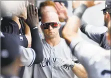  ?? Jason Miller / Getty Images ?? The Yankees’ Brett Gardner celebrates after hitting a two-run homer in the second inning against the Indians on Sunday.