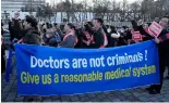  ?? ?? Doctors march toward the presidenti­al office during a rally against the government's medical policy in Seoul, South Korea, February 25, 2024.