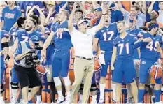  ?? JOHN RAOUX/AP ?? UF coach Dan Mullen celebrates the Gators’ 27-19 win Oct. 6 against LSU.