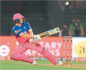  ?? —BCCI ?? Steve Smith of the Rajasthan Royals plays a shot on way to his half-century against Chennai Super Kings in their IPL match at the Sharjah Cricket Stadium in the United Arab Emirates on Tuesday.
