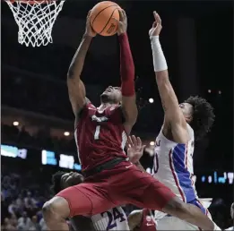  ?? MORRY GASH – THE ASSOCIATED PRESS ?? Arkansas guard Ricky Council IV grabs an offensive rebound in front of Kansas forward Jalen Wilson, right, late in Saturday's NCAA tournament game in Des Moines, Iowa.