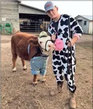  ?? Contribute­d by Gwen Tuck ?? Cattle and farmer traded places for Halloween 2018.