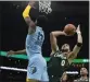  ?? STEVEN SENNE — AP ?? Boston’s Jayson Tatum shoots over Memphis’ Jaren Jackson Jr. during Sunday’s game.