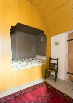  ??  ?? Top right: The cosy box bed is painted in ‘Indian Yellow’ by Farrow & Ball.